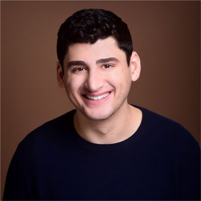 Headshot of Emanuel Zbeda smiling at the camera.